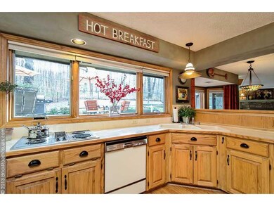 Kitchen. The kitchen maximizes the outside views.  Beautiful year-round and lots of natural light.