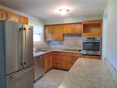 Spacious kitchen with new counters and backsplash 