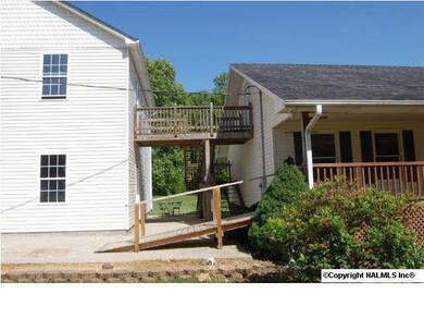 The 2-story garage has an entrance on the first floor and stairway to the top floor as well.