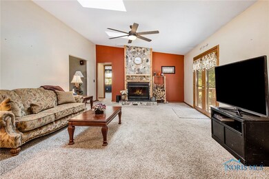 Relax by the fire with views of the wooded lot