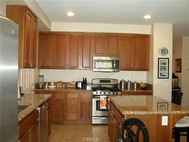 Kitchen with lots of cabinets and granite countertops and stainless steel appliances!