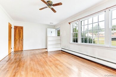 Living room with hardwood floors and great windows
