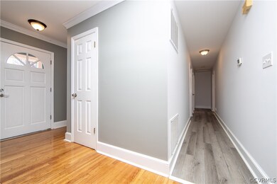 Foyer, Coat Closet, Hallway to Bedrooms and Baths.