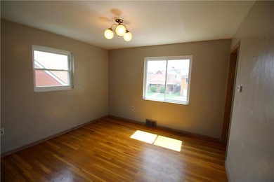 Dining room with hardwood floors.
