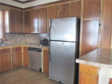 Kitchen with range, dishwasher and...