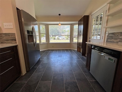 Kitchen with stainless steel appliances, light co