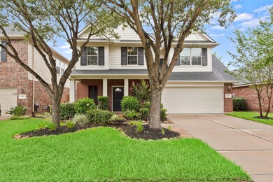 Enjoy the updated landscaping, well trimmed front trees and the natural screen of crepe myrtles between homes.