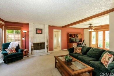 Living room has views of tranquil garden with frui