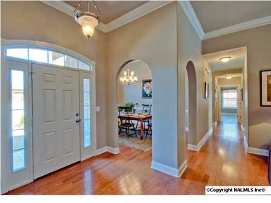 Graceful arched doorways add character while giving a sense of enclosure and yet keeping the floor plan open and flowing.