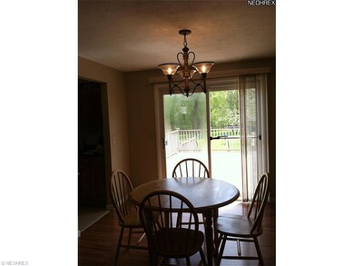 Dining room has updated Pergo flooring and slding 