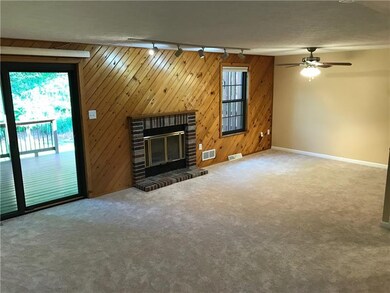 Open area from dining room through living room.  B