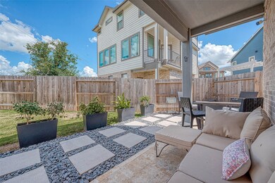 Enjoy a nice-sized backyard featuring a custom cov
