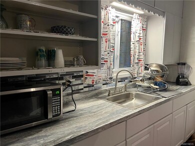 Kitchen with some newer cabinets and older but ble