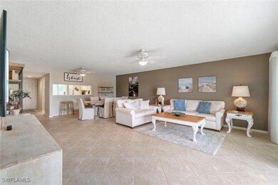 Living area featuring a textured ceiling, ceiling