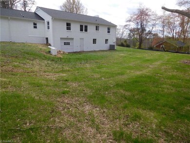 Extra Driveway added to make the turnaround much easier.  ALL NEW ROOF & WINDOWS.  Complete Remodel.  Recently Landscaped, front and back.