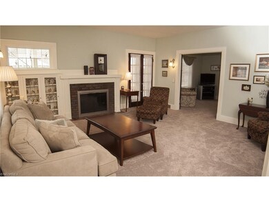 Inviting living room. French doors lead to the cov