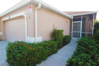 View of home's exterior with a garage and a sunroo