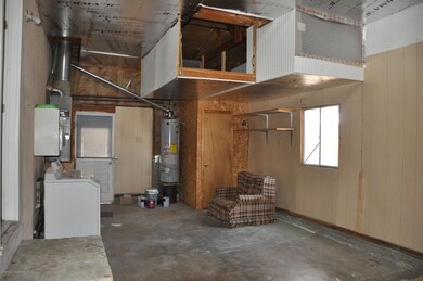 Unheated former garage