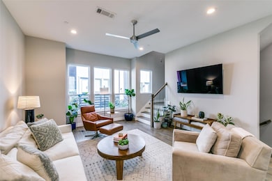 Living room with light hardwood / wood-style floor
