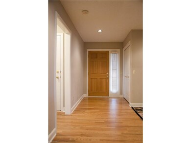 Foyer entry with charming hard wood floor
