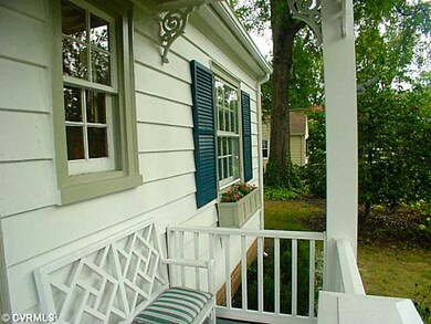Exterior Front - Covered front porch with bench.
