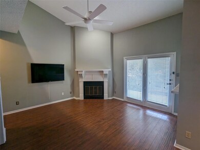 Unfurnished living room featuring wood finished f