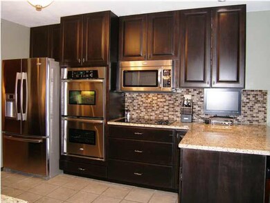 The north wall of the kitchen features large drawe