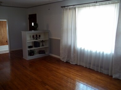 Built in bookcase/shelves  a large picture window 
