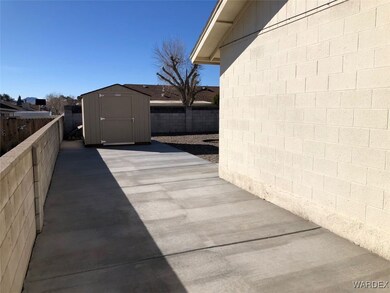 View of patio / terrace with a shed