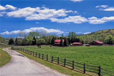 Property view of mountains with a view of trees an