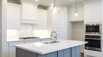 Kitchen featuring appliances with stainless steel
