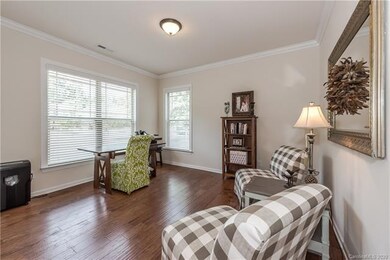 Front office with crown molding and large windows