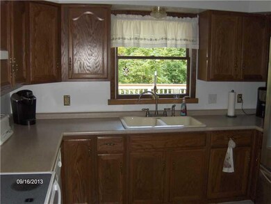 Kitchen. Kitchen has lots of wood cabinets