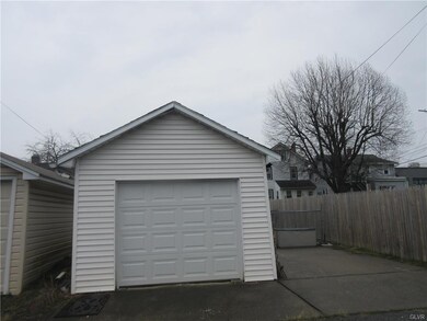Garage, updated door, note the parking pad to the 