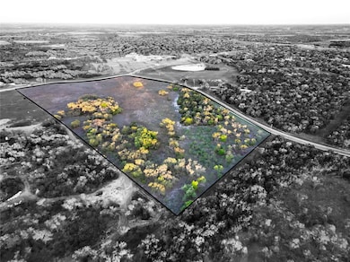 Aerial view of property and surrounding area with property parcel outlined