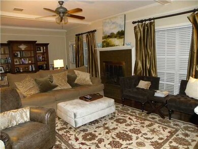 Elegant wood flooring and smooth beamed ceiling.