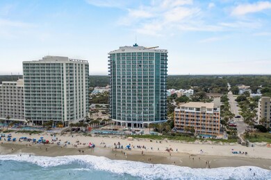 Bird's eye view with a water view and a beach view
