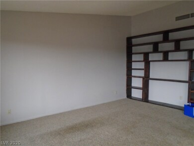 Living room has built in bookcase