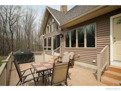 Patio/Deck. Elevated rear stamped concrete deck w/