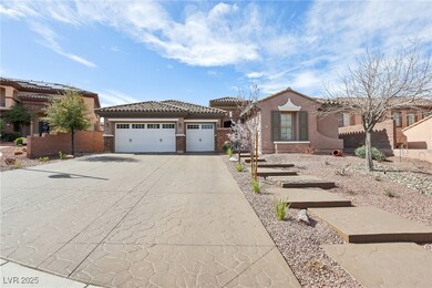 View of front of house featuring a garage, a tiled