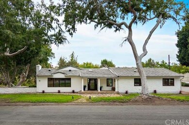 Modernized ranch-style home on a beautiful tree-li