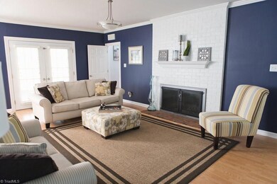 Open & Bright, the Family Room has Double French Doors that Open up to the Generous Screened Porch.  It has 2 Gracious Built In Bookshelves and Cabinets.  There is a Separate Staircase (w/extra wood topper for safety on the steps) leading to the Bonus Room. The Oversized Fireplace is wood burning, but Gas Logs could be easily installed.
