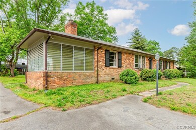 Ranch-style home with a front lawn