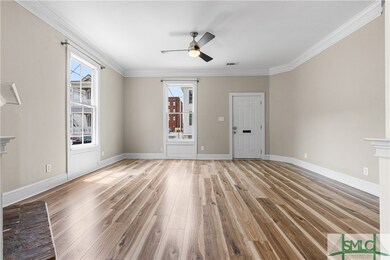 Crown molding and hardwood-style flooring