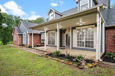 Back of property with a yard