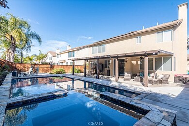 HUGE hot tub that flows into the pool.