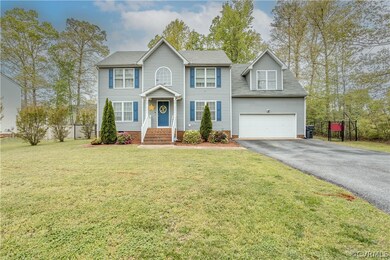 View of front of property with a front yard and a