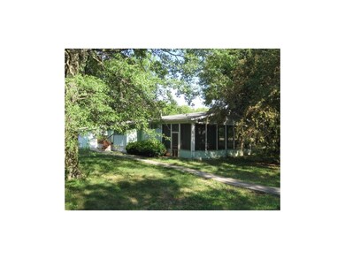 Screened in porch and lots of shade trees.