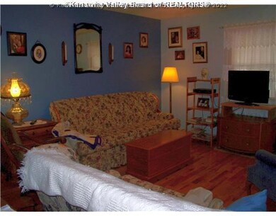 Living Room. Home has lovely hardwood throughout t