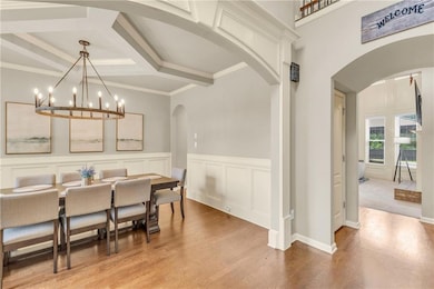 Dining area featuring a chandelier, crown molding,